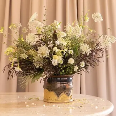 Luxury interior styling detail with travertine and dried blooms