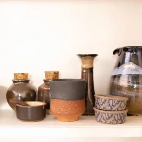 Ceramic collection styled on an open shelf