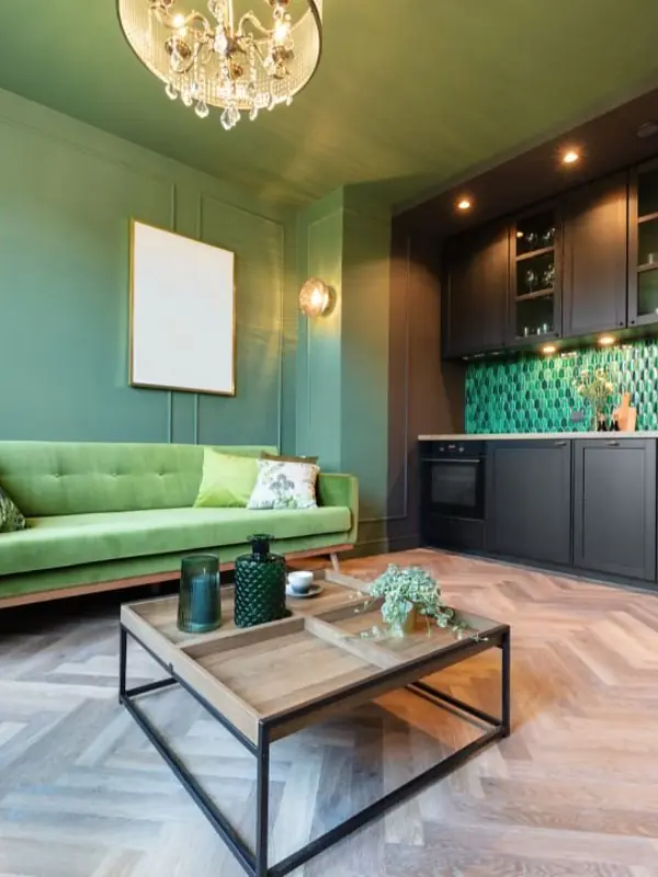 Interior design project in Nashik with green panelling and herringbone floor